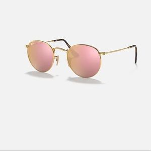 Pink round flat ray bans selling for originally $200